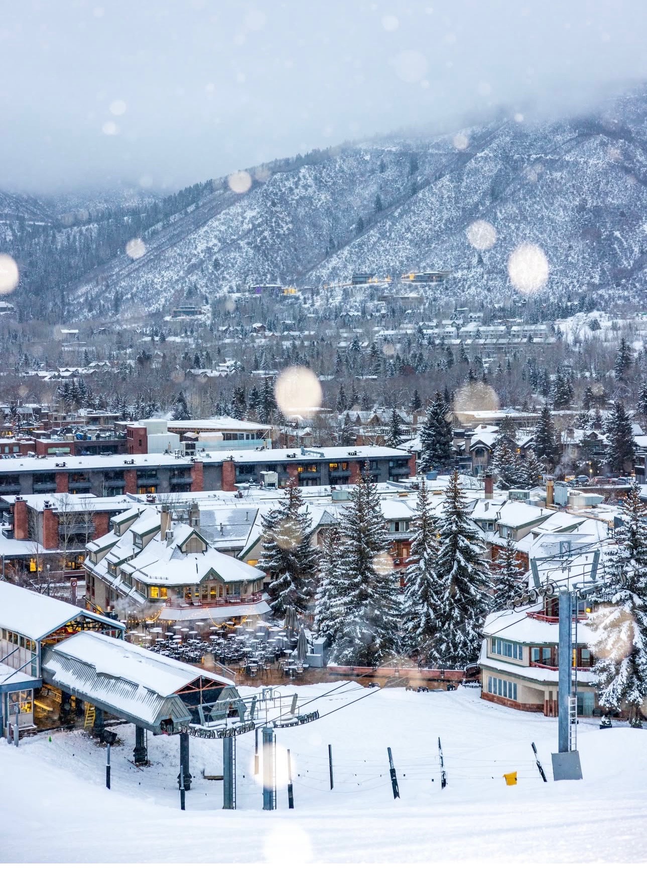 Scenic view of Aspen ski resort with snow-covered mountains and village